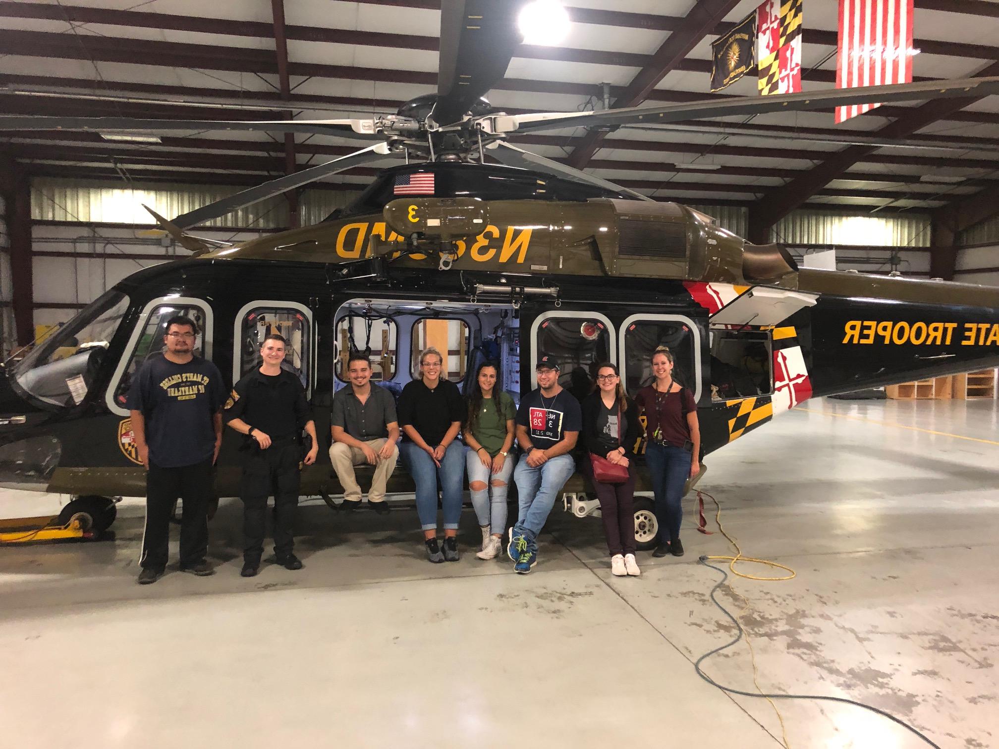 Group sitting on helocopter